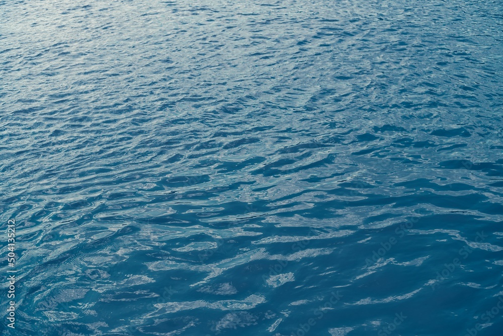 Calm ripple on water surface. River, lake, pond, sea pure blue water. Abstract natural background. Calm ripple on water surface. River, lake, pond, sea pure blue water. Abstract natural background.