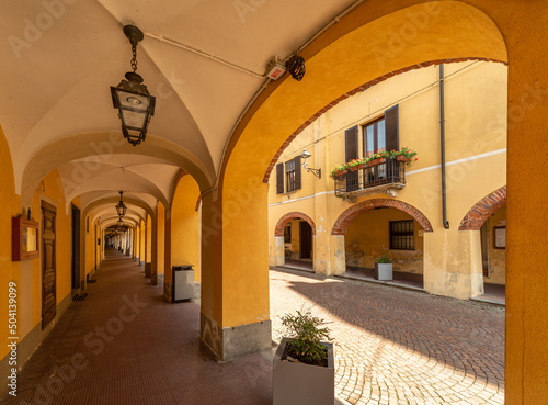 Caramagna Piemonte, Piedmont, Italy - May 10, 2022: Ancient historical arcades in via Luigi Ornato
