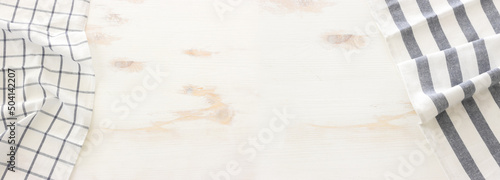 top view of vintage tablecloth with over white wooden background
