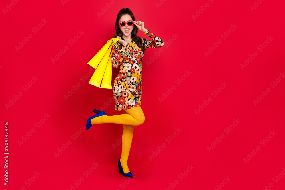 Photo of stunning lady buyer enjoy offer shopping bags wear tights skirt high heels isolated bright color background Photo of stunning lady buyer enjoy offer shopping bags wear tights skirt high heels isolated bright color background