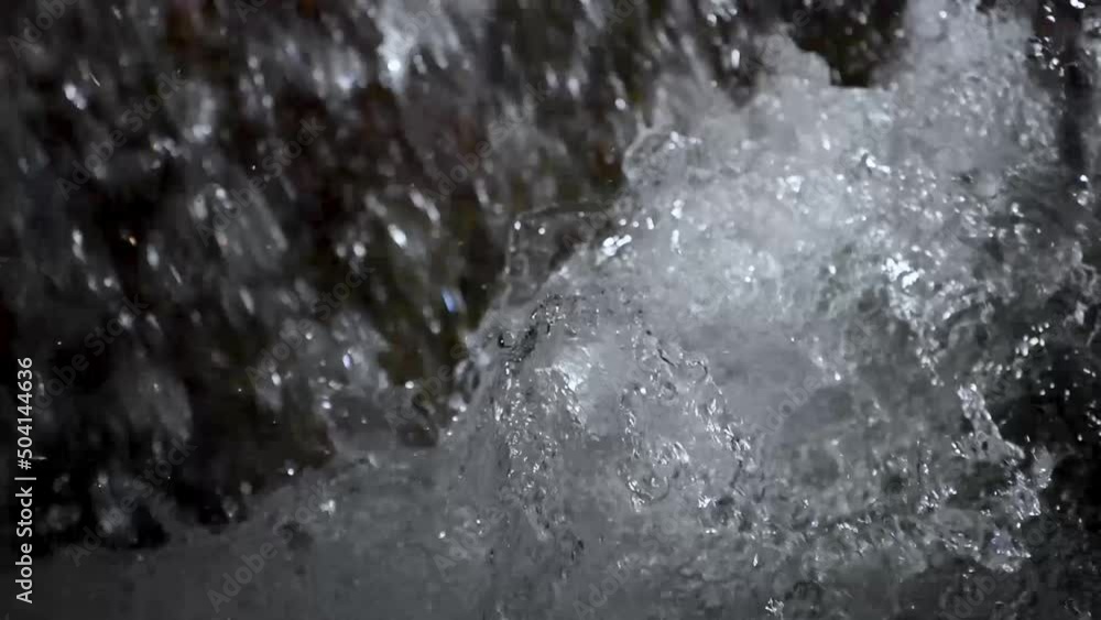 Falling and splashing water, close-up, slow-motion Falling and splashing water, close-up, slow-motion