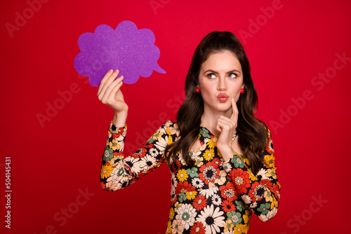 Photo of pretty dreamy woman wear flower print dress looking empty space mind cloud isolated red color background