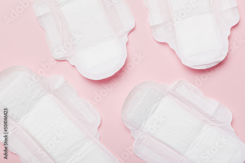 Women hygiene products or sanitary pad on colored background. Pastel color. Closeup. Empty place for text. Female daily hygiene