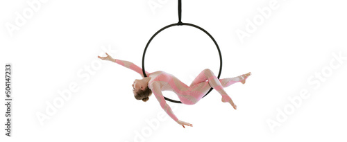 Portrait of young sportive girl, air gymnast performing on hoop isolated over white studio background. Flyer image