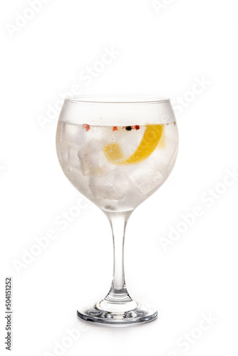 Gin tonic cocktail drink into a glass isolated on white background
