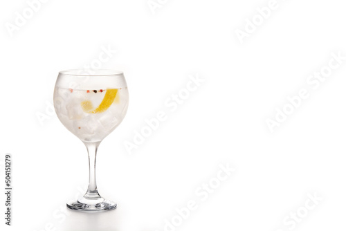 Gin tonic cocktail drink into a glass isolated on white background. Copy space