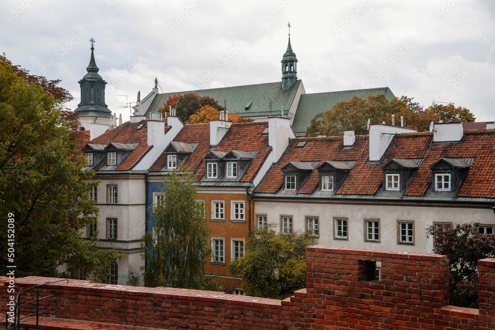 Warsaw, Poland, 13 October 2021: picturesque street with colorful buildings in historic center in medieval city, renaissance and baroque historical buildings near Barbican fortifications, sunny day Warsaw, Poland, 13 October 2021: picturesque street with colorful buildings in historic center in medieval city, renaissance and baroque historical buildings near Barbican fortifications, sunny day