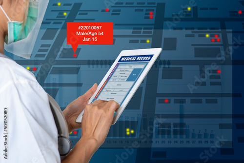 Fotografía Female doctor searches for patient medical records on digital tablet to analyze epidemiological data
