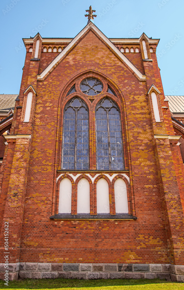 Fototapeta premium Closeup of architectural details of the Catholic Church of the Nativity of the Blessed Virgin Mary, built in the years 1905-1912 in the neo-Gothic style in Rajgród in Podlasie, Poland.