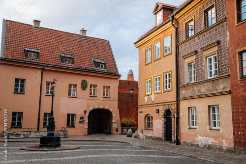 Warsaw, Poland, 13 October 2021: picturesque street with colorful buildings in historic center in medieval city, renaissance and baroque historical buildings near Barbican fortifications, sunny day