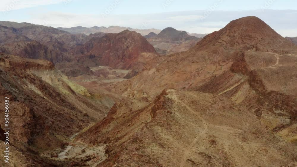 Aerial view overlooking layers of rocky erosion shapes in the highlands of Kingman, USA - circling, drone shot Aerial view overlooking layers of rocky erosion shapes in the highlands of Kingman, USA - circling, drone shot