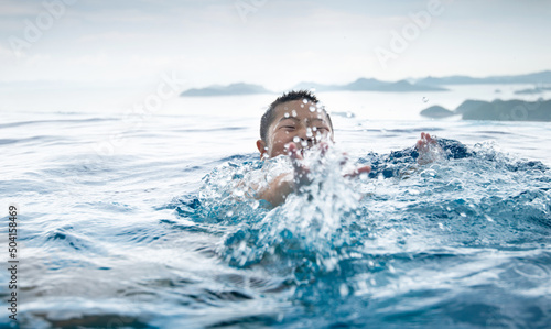 Boy swimming in the sea © xy