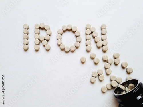 written iron with iron supplement tablets