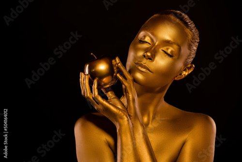Portrait of beautiful woman close her eyes hold golden cover apple feel seduction want to try wicked forbidden treat