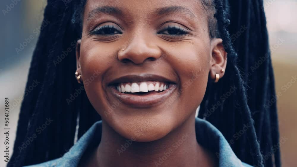 Young woman looking at the camera and smiling
Young woman looking at the camera and smiling