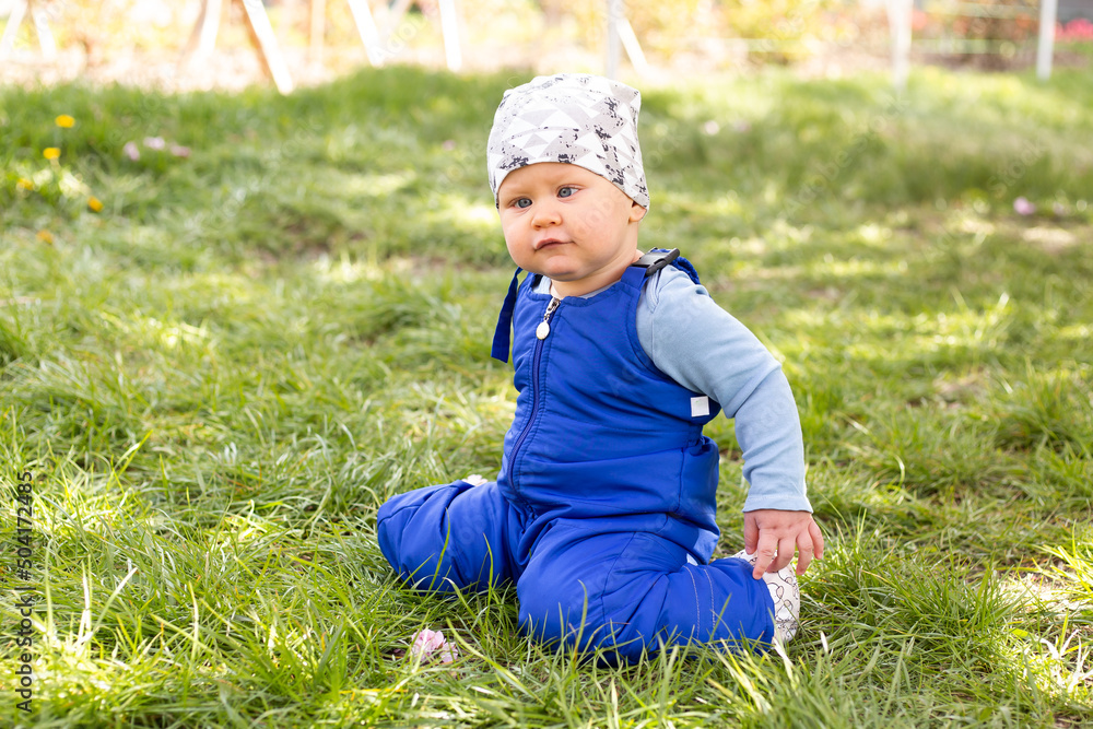 baby boy portrait of child outdoor with strabismus eyes baby boy portrait of child outdoor with strabismus eyes
