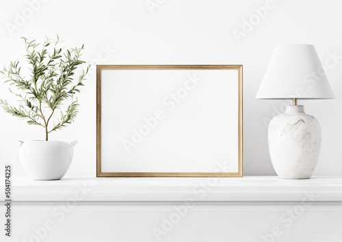 Painting art mockup with empty horizontal wooden frame standing in simple traditional home interior with small olive tree and classic marble lamp on white background. Illustration, 3d rendering