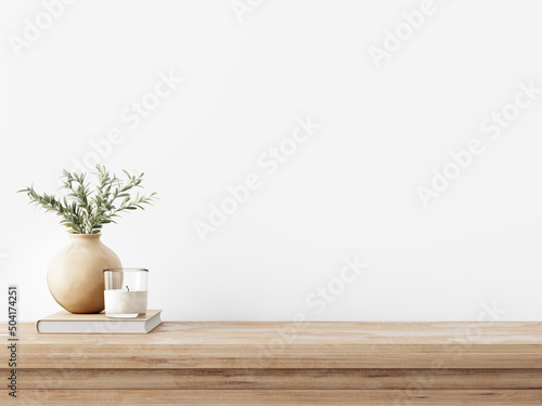 Canvas Traditional interior wall mockup with green twigs in vase and candle standing on light brown wooden table on empty white background