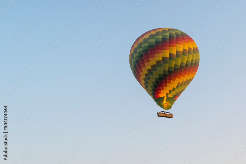 Naklejka premium Colorful hot air balloon in the sky with copy space