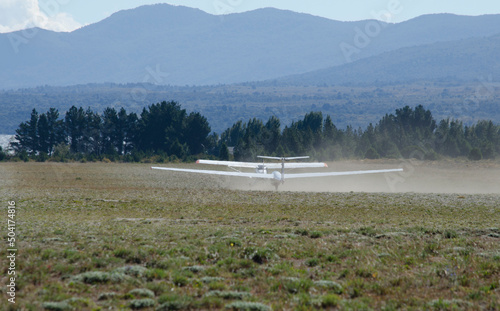 small plane towing ultralight glider, bariloche aerodrome photo