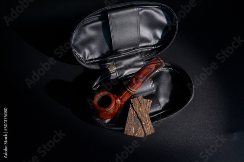 classic bent pipe in a leather pouch