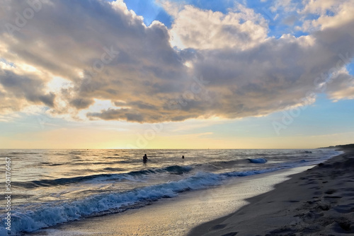 beautiful seaside landscape at dawn under cloudy sky