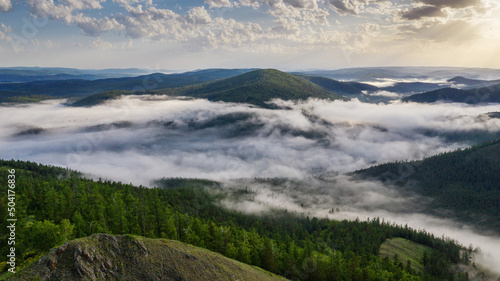 Southern Urals  Ural Mountains  mountain taiga  morning mist in the mountains. Aerial view.