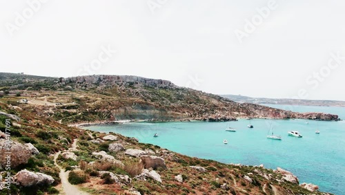 Aerial drone shot of Imġiebaħ Beach in Malta on a beautiful sunny day photo