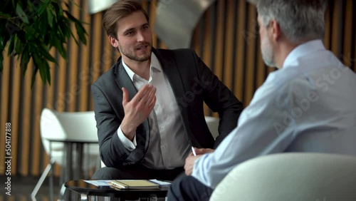 Professional investment consultant consult client investor about financial contract explain online startup purchase deal sell service make business offer give presentation advice at meeting