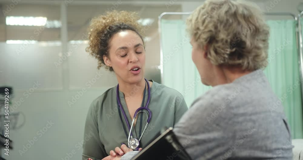 Doctor taking Senior Patient Blood pressure in Doctors Office Doctor taking Senior Patient Blood pressure in Doctors Office