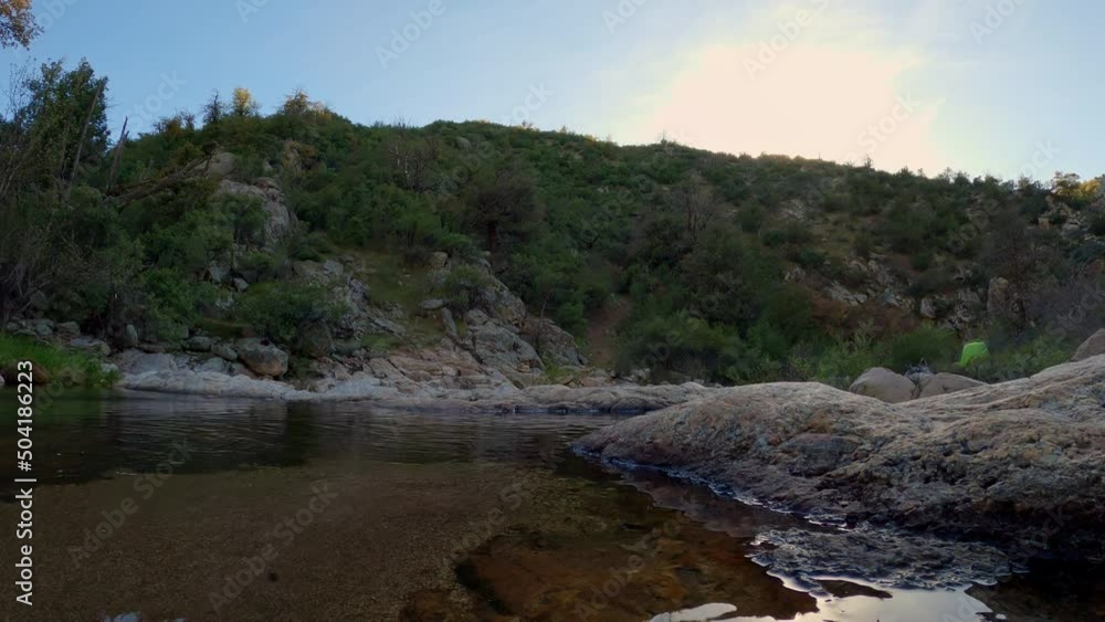 Time Lapse of Tranquil natural scene, Pond on rocky landscape, Male explore the location Time Lapse of Tranquil natural scene, Pond on rocky landscape, Male explore the location