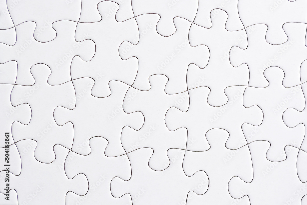 Puzzle pieces isolated on blue background. Flat lay. Directly above. Puzzle pieces isolated on blue background. Flat lay. Directly above.