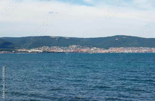 Slika na platnu Black sea, blue water, hotels of resort area where people rest are visible in di