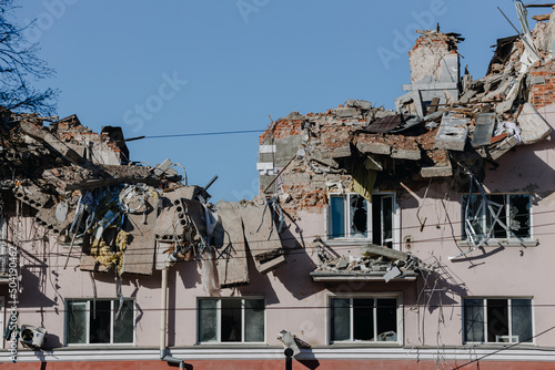The ruins of the Hotel Ukraine against the blue sky in the city of Chernihiv during Russia's war against Ukraine in 2022. Destroyed roof, walls, windows of buildings. Airstrike photo