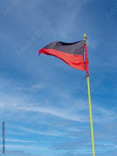 Waving flag on the beach