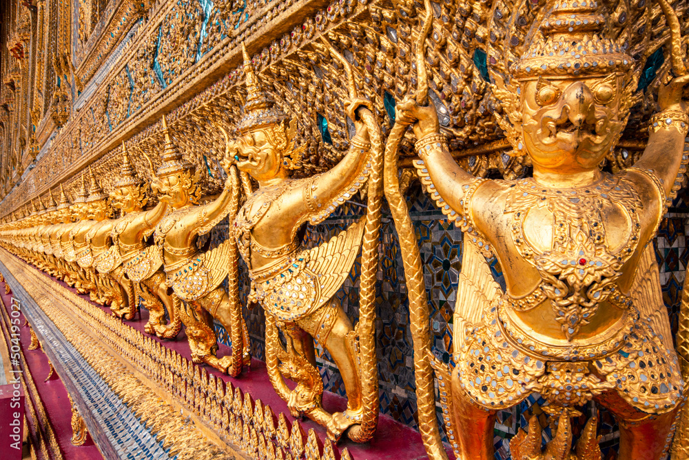 Golden garuda statues in Wat Phra Keaw (The Royal Grand Palace), Those are building around Temple of Emerald Buddha, Bangkok, Thailand. Golden garuda statues in Wat Phra Keaw (The Royal Grand Palace), Those are building around Temple of Emerald Buddha, Bangkok, Thailand.