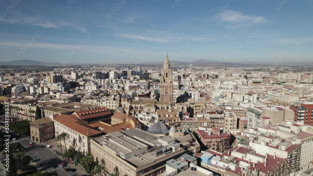 Drone pan reveals dense city construction around Murcia Cathedral Drone pan reveals dense city construction around Murcia Cathedral