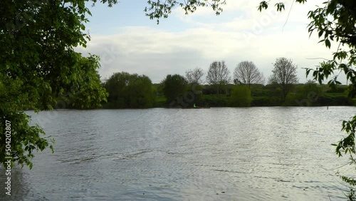 4k zoom-in shot of single rower in a rowboat on Weser river in Bremen.