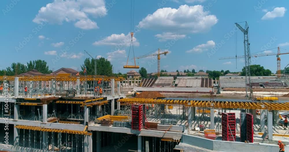Construction process of a modern football stadium. Builders make