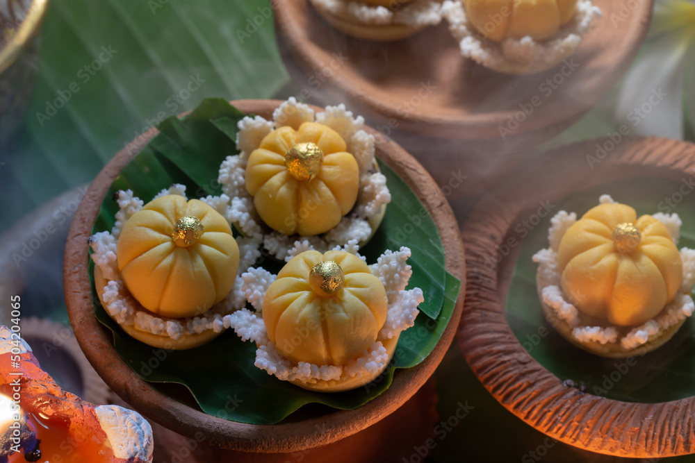 Close up view of several Thai traditional desserts served on banana leaves Close up view of several Thai traditional desserts served on banana leaves