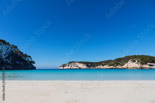 Aguas turquesas y arena blanca de la playa de Cala Galdana, en Menorca (Islas Baleares, España) photo