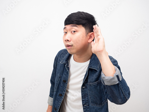 Asian man gesture I can't hear and want lounder photo