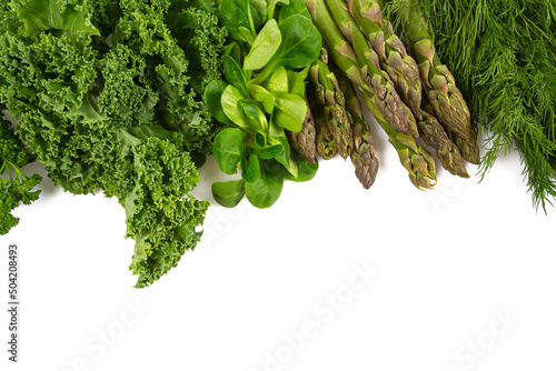green herbs and vegetables isolated on white background