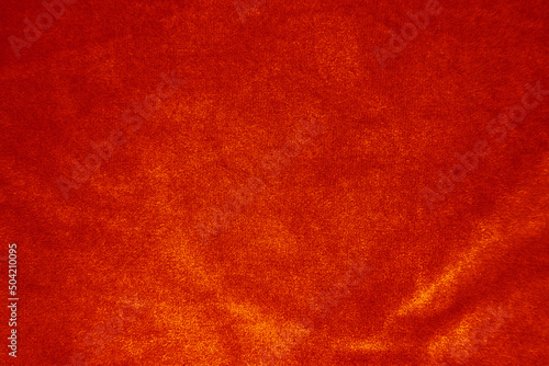 Orange velvet fabric texture used as background. Empty Orange fabric background of soft and smooth textile material. There is space for text...