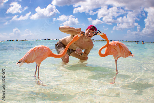 man on flamingo beach in aruba