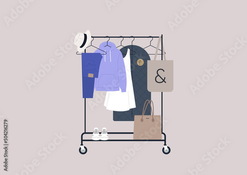 A rail with clothes hanging on hangers, fashion concept