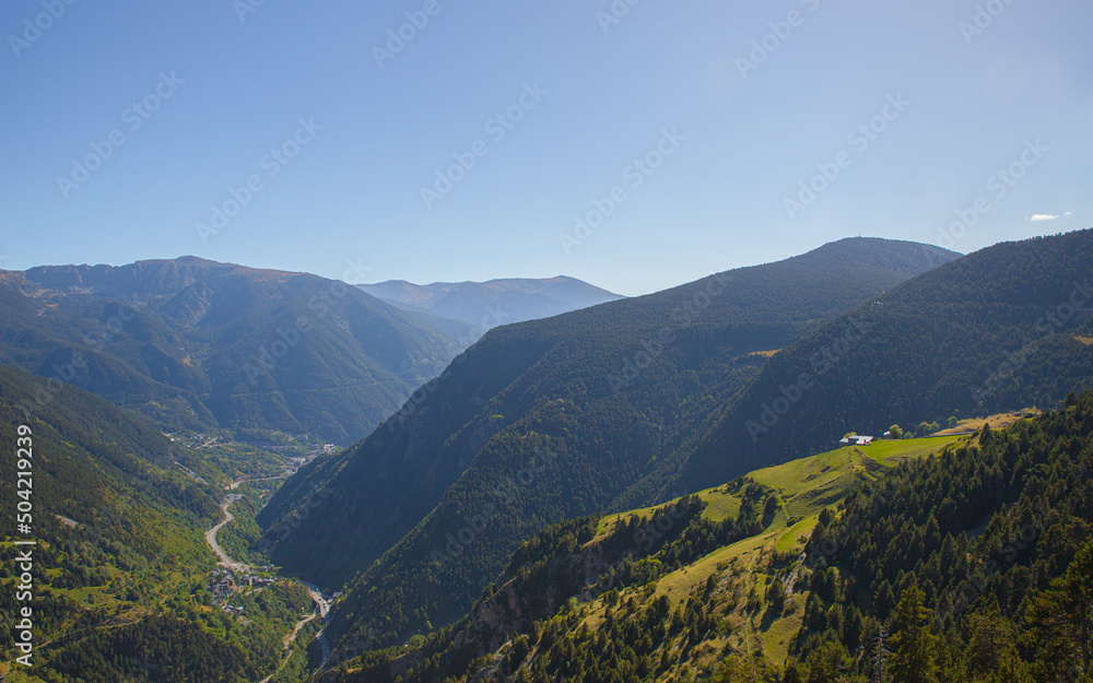 Naklejka premium Beautiful nature landscape of green mountains and a clear blue sky during a sunny spring day in Andorra