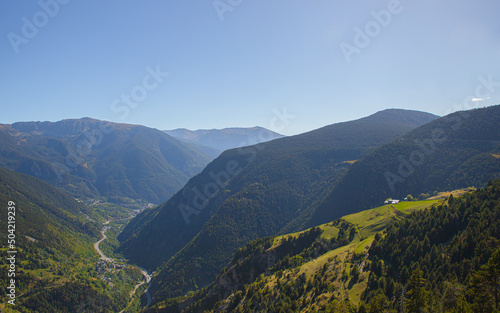 Beautiful nature landscape of green mountains and a clear blue sky during a sunny spring day in Andorra