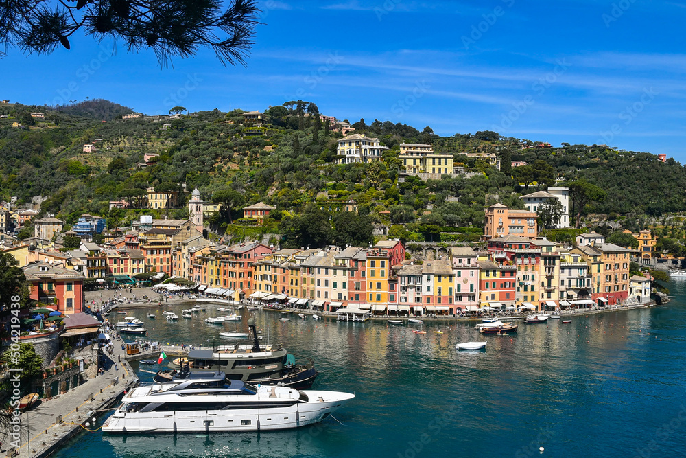 Elevated view of the historic fishing village and popular holiday resort on the shore of the Tigullio Gulf, Portofino, Genoa, Liguria, Italy