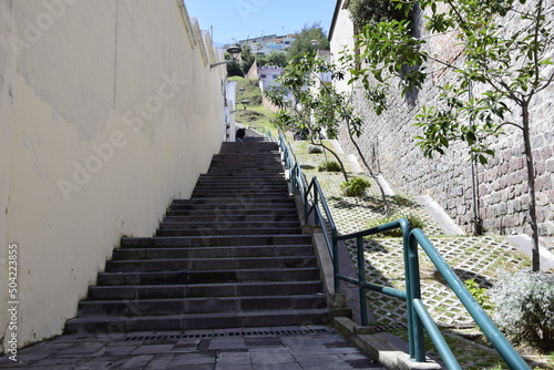 concrete stairs on typical colonial street in historic district, Quito